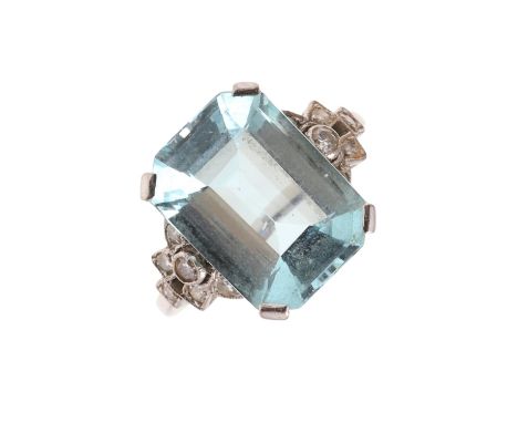 the step-cut aquamarine is set with six circular-cut diamonds to each shoulder, in 18ct white gold, 4.5 grams. Size L 1/2.  *
