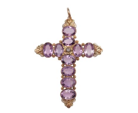 set  with oval-shaped amethysts in a two colour gold mount with foliate decoration, centred with a rose-cut diamond, 7 x 5.5c