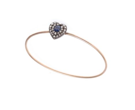 the gold bangle mounted with a heart set with rose-cut diamonds and centred with an oval-shaped sapphire, internal measuremen