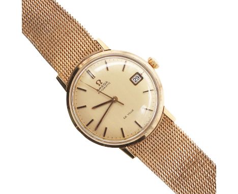 the signed gold coloured dial with baton numerals and date aperture, with Omega logo to the winder and to the bracelet clasp,