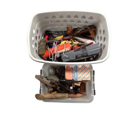 Two plastic tubs containing a quantity of hand tools, Stanley woodworking planes, vintage paraffin lamp etc.