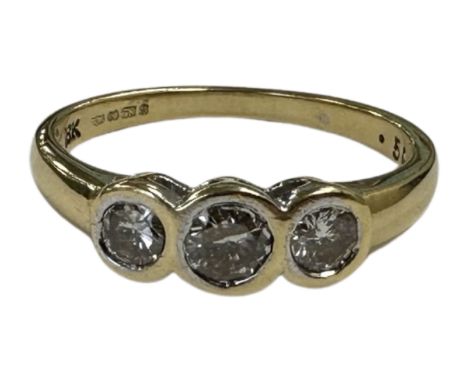 An 18ct gold three stone diamond set ring, the stated total diamond weight 0.50 carat, size N.  CONDITION REPORT: 3.2g