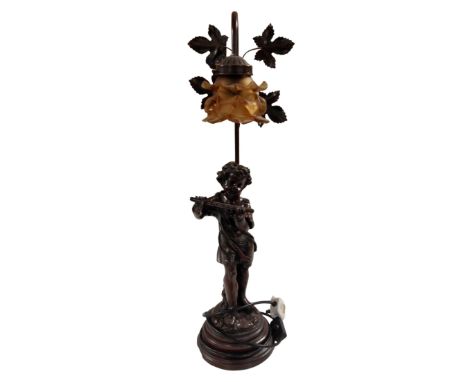 A figural table lamp with shade, girl with flute.