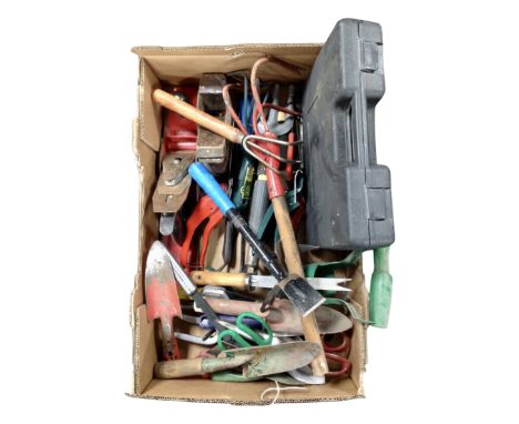 A box containing a collection of assorted hand tools, garden tools, a cased soldering kit, woodworking planes.