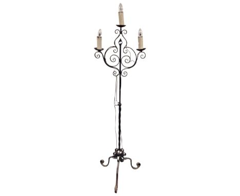 A wrought iron three way standard lamp 