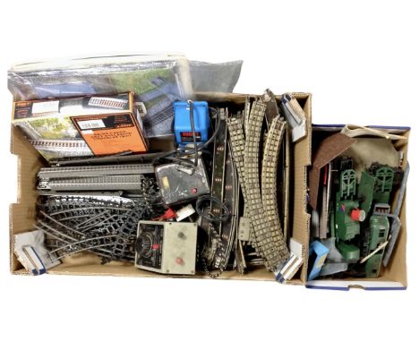 Two boxes containing Tri-ang, Marklin and Hornby OO track, Tri-ang and Peco catalogues, track mat, signals, water towers, con