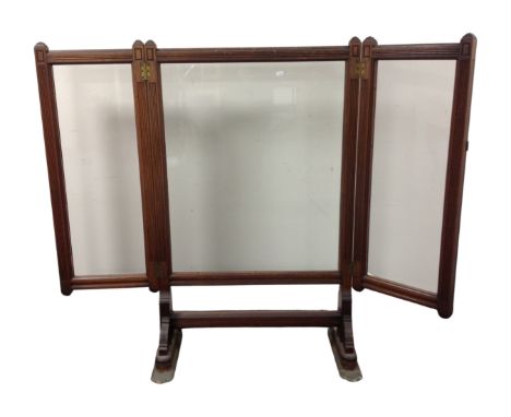 A 19th century mahogany three way glass panelled fire screen 