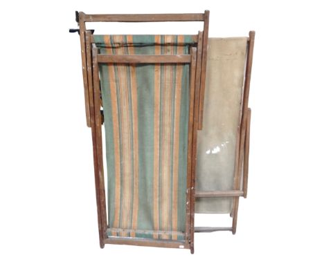 Two vintage folding deck chairs together with a large quantity of assorted garden tools 