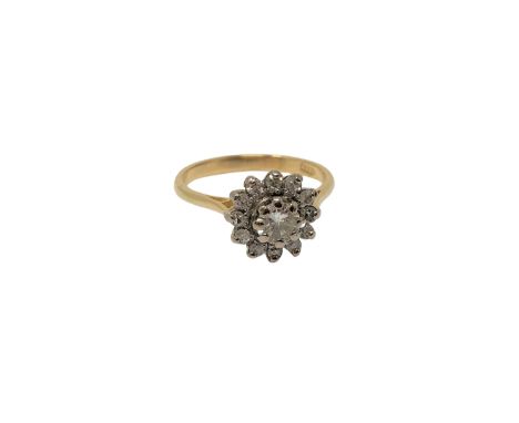 An 18ct gold diamond cluster ring, the central stone approx. 0.30 carat, size M CONDITION REPORT: 3g