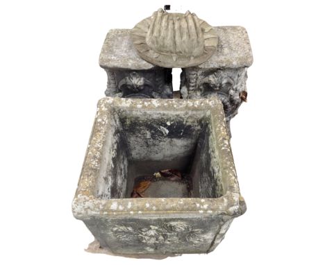 A pair of concrete garden pedestals together with a square planter and sun wall plaque 