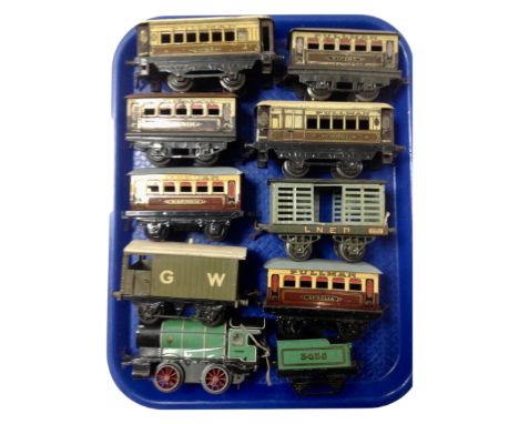 A tray containing Hornby Tri-ang tin plate 3435 engine with tender together with Pullman coaches, an LNER wagon etc. (10)