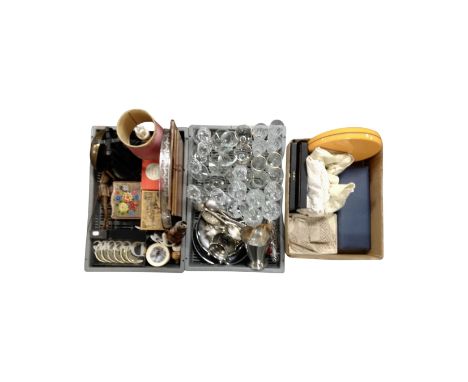 Two crates and a box containing vintage electricals, ashettes, silver plated pieces, table linen, stainless steel drinking gl