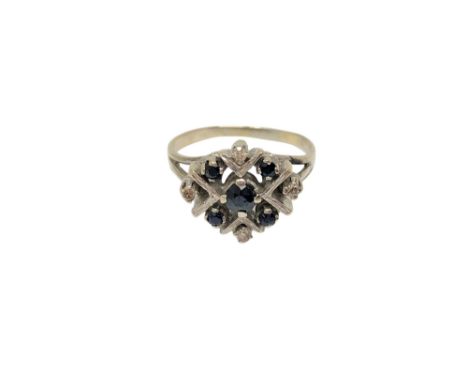 A white gold sapphire and diamond cluster ring, size O