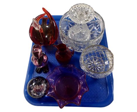 A tray containing assorted glassware including a crystal rose bowl, cranberry glass jug, Venetian glass bird ornaments, glass