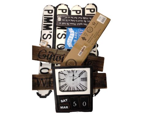 A box containing assorted wooden notices, a battery operated calendar wall clock.