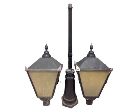 A Victorian style garden light in the form of a street light with extra lantern top 