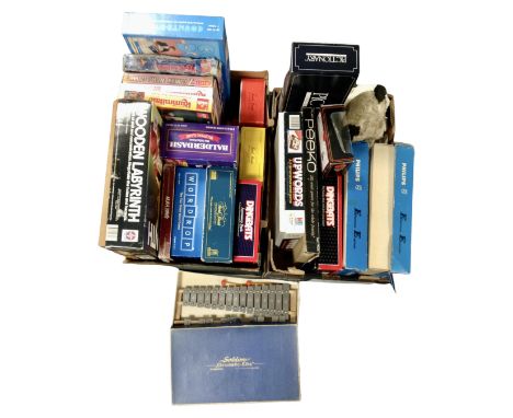 Two boxes containing assorted board games, exclusive first edition die cast busses, Philips electric engineer sets etc.