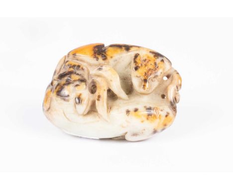 A Chinese pebble jade carving of entwined beasts, possibly leopards, 20th Century, 5cm x 7cm