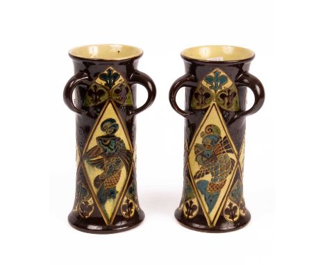 Charles Brannam (1835-1937) a pair of Barnstaple Pottery vases of waisted cylindrical form, each with three handles, moulded 