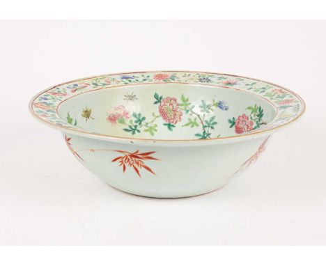A 19th Century famille rose porcelain basin, Qing dynasty, decorated a lady on a balcony to the interior, surrounded with flo