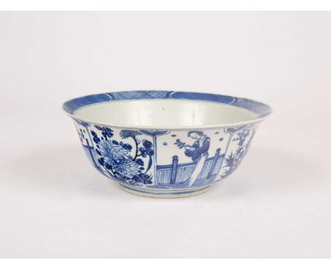 A Chinese blue and white bowl, Kangxi marks but of a later period, the interior decorated flowers, the exterior with alternat