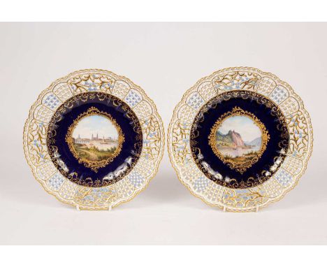 Two Meissen topographical plates with finely pierced rims, the centres with a titled view of 'Dresden' and 'Shreckenstein bei