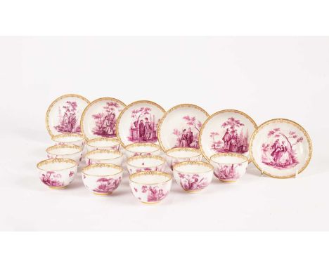 A Meissen set of six saucers and twelve tea bowls, circa 1740, painted in puce camaieu with Watteau-style scenes of figures i