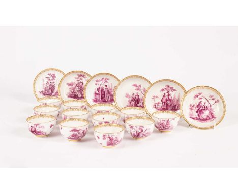 A Meissen set of six saucers and twelve tea bowls, circa 1740, painted in puce camaieu with Watteau-style scenes of figures i