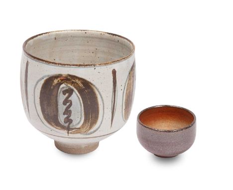ARR David Leach (born 1939) a stoneware footed bowl in a speckled pale glaze, decorated with blue and brown abstract design, 