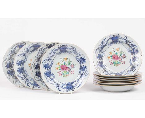 Eleven Chinese soup plates, Qianlong circa 1780, painted with a central flower bouquet within wide border of blue stylised sc