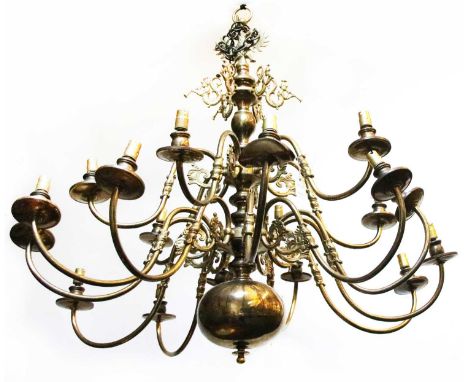 A pair of Dutch style brass eighteen light electroliers, with figural scrolls, 100cm diameter, 92cm high (2)