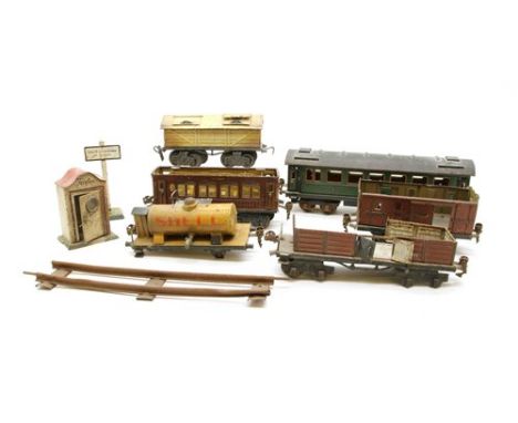 A collection of O gauge rolling stock, to include a Marklin Speisewagen 1886/0 dining car, a similar Marklin coach with green