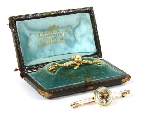 A reverse painted crystal intaglio fox head bar brooch, with an applied dome painted with a fox head on a mother of pearl gro