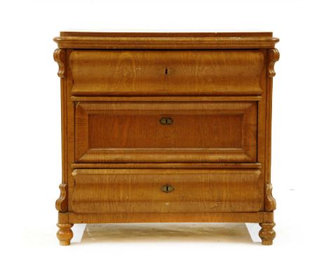 A 19th century continental elm commode chest, fitted with three drawers on turned feet, 90cm wide, 51cm deep, 86cm high