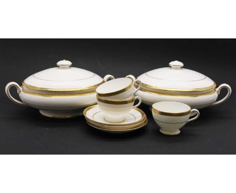 A Minton Winchester service, to include treens, soup coupes, dinner plates, sauce boat, tea cups, creamer, teapot, condiment 