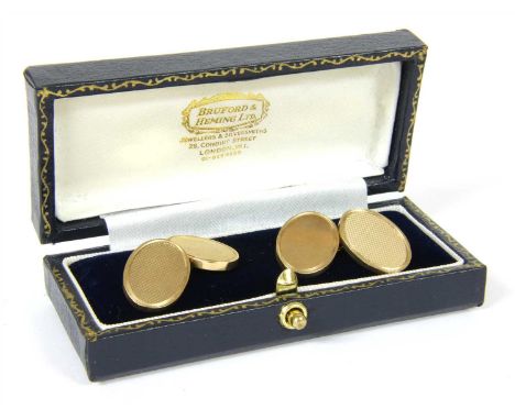 A pair of 9ct gold oval chain link cufflinks, with two engine turned plates, Birmingham 1989, 19.90g