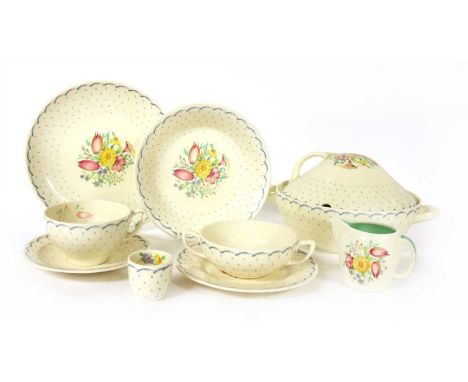 A Susie Cooper 'Printemps' pattern dinner service, comprising dinner plates, side plates, egg cups, two tureens, meat plate e