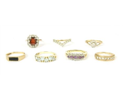 A collection of seven gold and stone set rings, to include five 9ct rings, one set with diamonds, one with black onyx, the ot