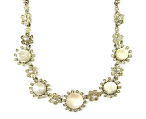 A cased silver moonstone and split pearl necklace, with a series of graduated clusters to the centrepiece, marked 900