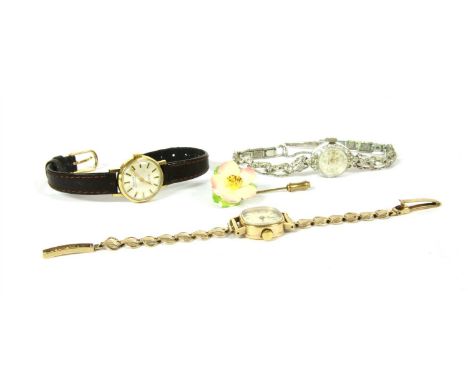 A ladies 9ct gold Tissot mechanical watch, on a later 9ct gold bracelet, a ladies gold plated Montine mechanical strap watch,