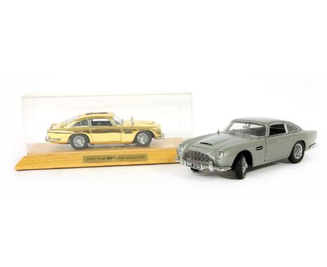 A Franklin Mint James Bond 007 gold painted Aston Martin DBS 1:24 scale diecast model, in original case, together with an Aut