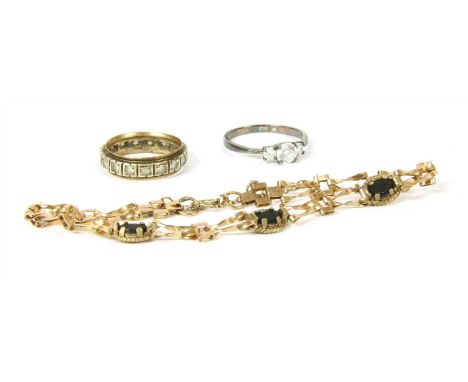 A 9ct gold two row twisted gate link bracelet, 11.39g, with opal triplets, a two colour gold full eternity ring marked 9ct, a