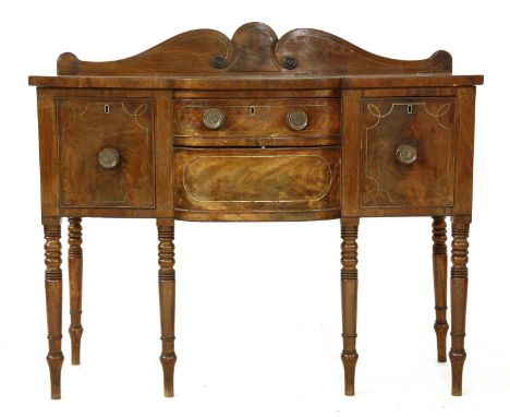A 19th Century mahogany and brass inlaid sideboard, with scrolled gallery over a bowfront section flanked by two doors, on ri