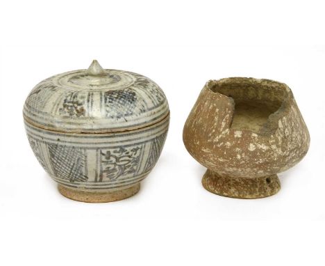 A Cambodian Khmer box and cover , 15th to 16th century, of tapering form on a short circular base, painted with panels of flo