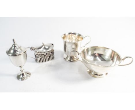 Four items of small silver ware to include christening mug, twin handled sugar basin, mustard pot with blue glass liner and a