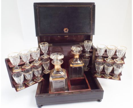 19th Century French ebonised and brass strung inlaid decanter box, the hinged lid opening to reveal a pair of decanters and 1