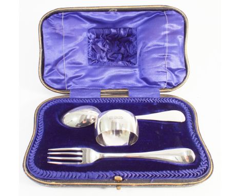 Boxed hallmarked silver christening set comprising fork, spoon and napkin ring in fitted box with blue silk liner 