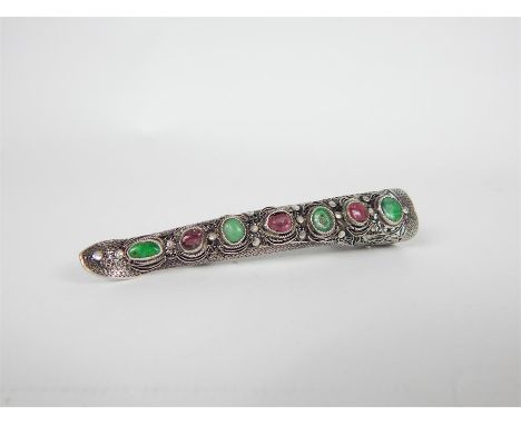A Fine 19th century Chinese Silver Filigree Fingernail Guard inset with Jade and Garnets, converted into a brooch; 8.5cm long