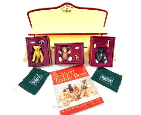 Three Enesco "Steiff Collection..100 years of Teddy Bears" ceramic bears with boxes together with a related display stand and