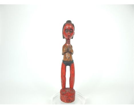 A 20th century tribal African carved light wood, female fertility figure, from the Fante People, Ghana; 27.5cm high.